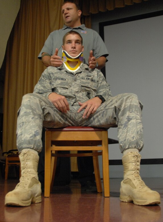 Pat Kelly, fire fighter paramedic from Orlando, Fla., shows Senior Airman Robert Fitzpatrick 736th Security Forces Squadron, the consequences of drinking and driving, and not wearing a seatbelt during Street Smart brief, Oct. 5, in the base theater.Street Smart, presented by Stay Alive from Education (S.A.F.E.), took the audience into the real-life drama experienced by firefighter paramedics as they work to save lives. (U,S. Air Force photo/ Airman 1st Class Anthony Jennings)
