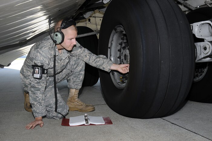 Senior Airman Michael Barrett from the 437th Aircraft Maintenance Squadron onboard Join Base Charleston-Air Base, checks the tire air pressure on a Charleston C-17 aircraft as part of the inspection prior to maintenance being performed Oct. 5. Upon arrival of an aircraft, a thorough inspection is conducted to ensure that the equipment on the aircraft is up-to-date on its maintenance unless they are otherwise previously scheduled for maintenance. (U.S. Navy photo/Mass Communication Specialist 1st Class Jennifer Hudson)