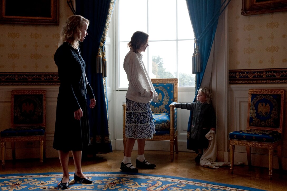 Sisters of U.S. Army Staff Sgt. Robert J. Miller, Patricia and Therese, wait with their niece, Lynn Silosky, in the Blue Room of the White House, Oct. 6, 2010, before President Barack Obama posthumously awarded the Medal of Honor to their  brother.