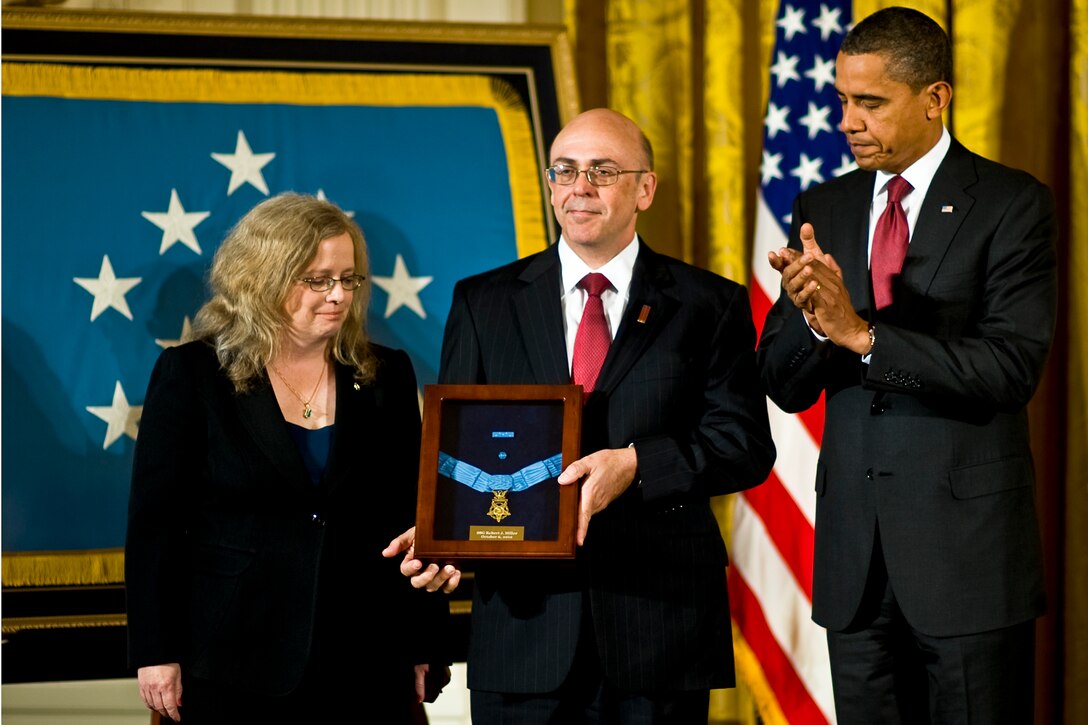 President Barack Obama presents the Medal of Honor posthumously to Phil and Maureen Miller, the parents of U.S. Army Staff Sgt. Robert J. Miller, in the East Room of the White House, Oct. 6, 2010.