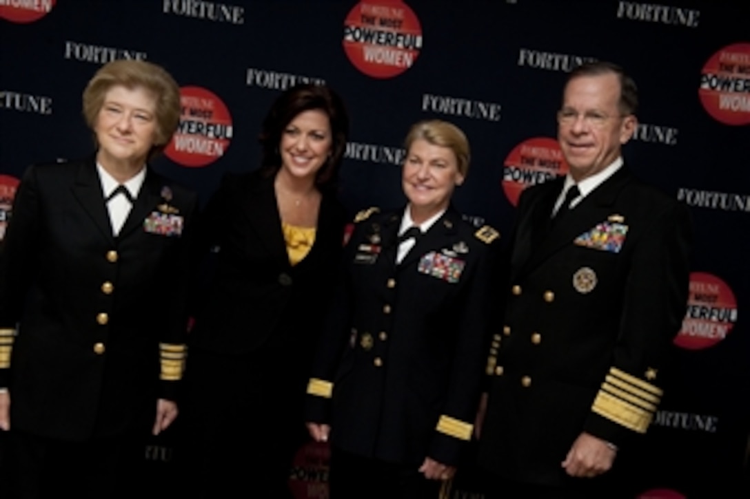 President of National Defense University Vice Adm. Ann Rondeau, CNN's Kyra Phillips, Commanding General of U.S. Army Materiel Command Gen. Ann Dunwoody and Chairman of the Joint Chiefs of Staff Adm. Mike Mullen pose for photos at the Fortune magazine's Most Powerful Women Summit in Washington, D.C., on Oct. 6, 2010.  