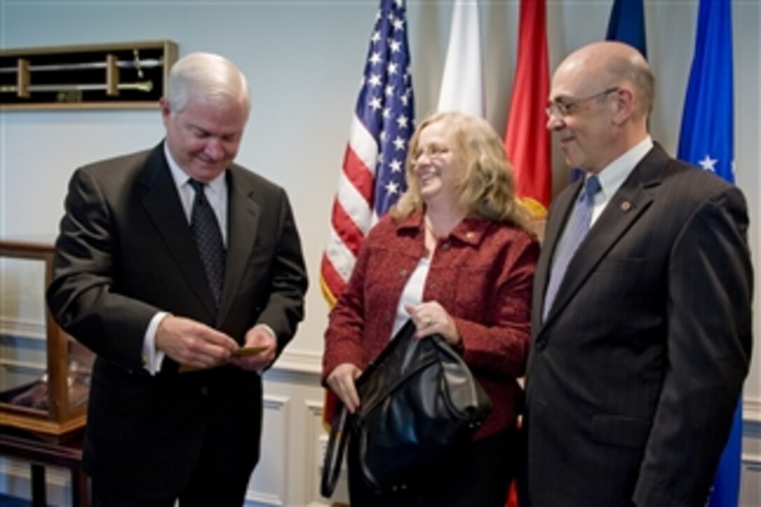 Secretary of Defense Robert M. Gates meets with the family of Medal of Honor recipient U.S. Army Staff Sgt. Robert J. Miller, father Phil Miller (right) and mother Maureen Miller (2nd from right), in his office in the Pentagon on Oct. 7, 2010.  Miller was posthumously awarded the nation's highest honor for his heroic actions in Afghanistan on January 25, 2008, after displaying immeasurable courage and uncommon valor eventually sacrificing his own life to save the lives of his teammates and 15 Afghanistan National Army soldiers.  