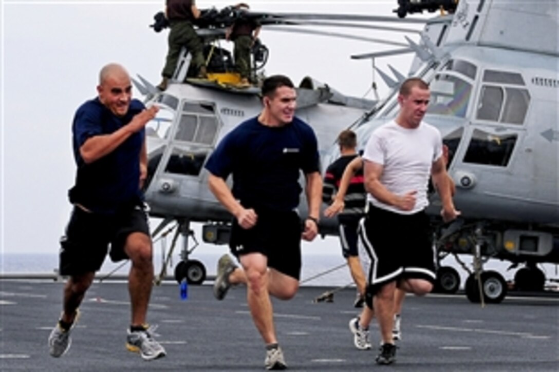 U.S. Marines exercise on the flight deck of the amphibious assault ship USS Essex in the Philippine Sea, Oct. 6, 2010. The Essex, part of the Essex amphibious ready group, is on patrol in the western Pacific. The Marines are assigned to the 31st Marine Expeditionary Unit.