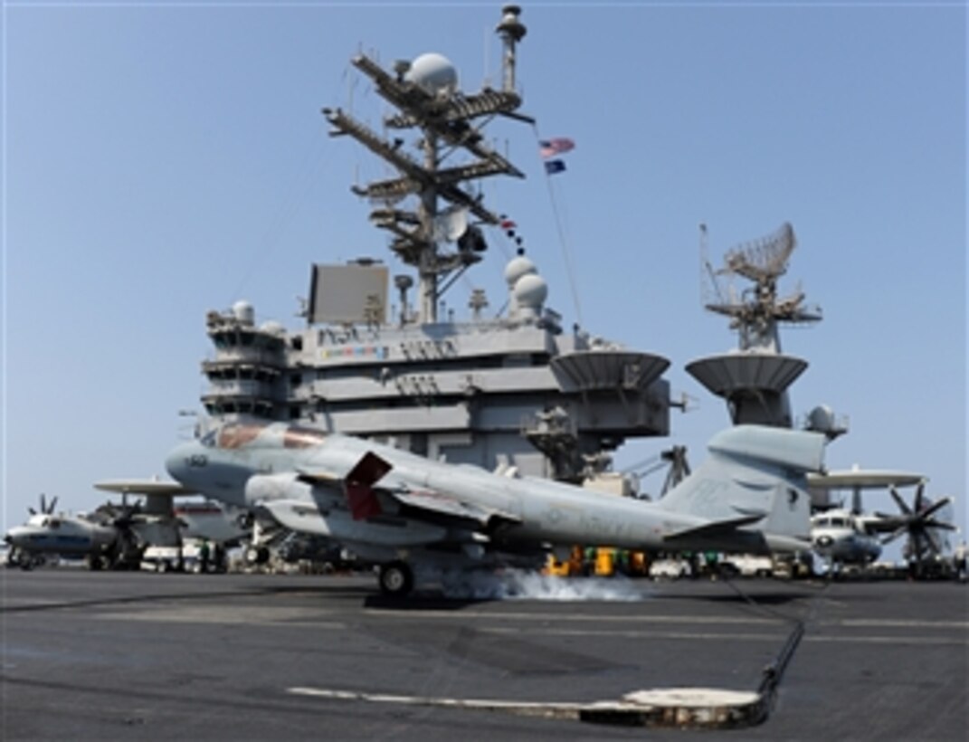 An EA-6B Prowler aircraft assigned to Electronic Attack Squadron 130 catches an arresting wire while landing aboard the aircraft carrier USS Harry S. Truman (CVN 75) on Oct. 4, 2010.  The ship is deployed in the Arabian Sea supporting maritime security operations and theater security cooperation efforts in the U.S. 5th Fleet area of responsibility.  