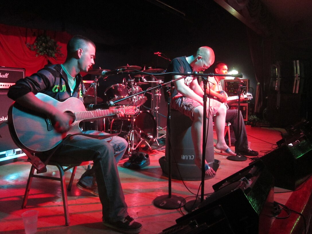 The Acoustics perform for the first time onstage at this year’s Rocktober Festival in the Club Iwakuni Ballroom Oct. 8. Armed with two guitars and a trash can, the band beat its way through several covers and a series of original pieces. The Acoustics name did not appear on the event’s flyer due to thefact they did not choose a name until halfway through their set.