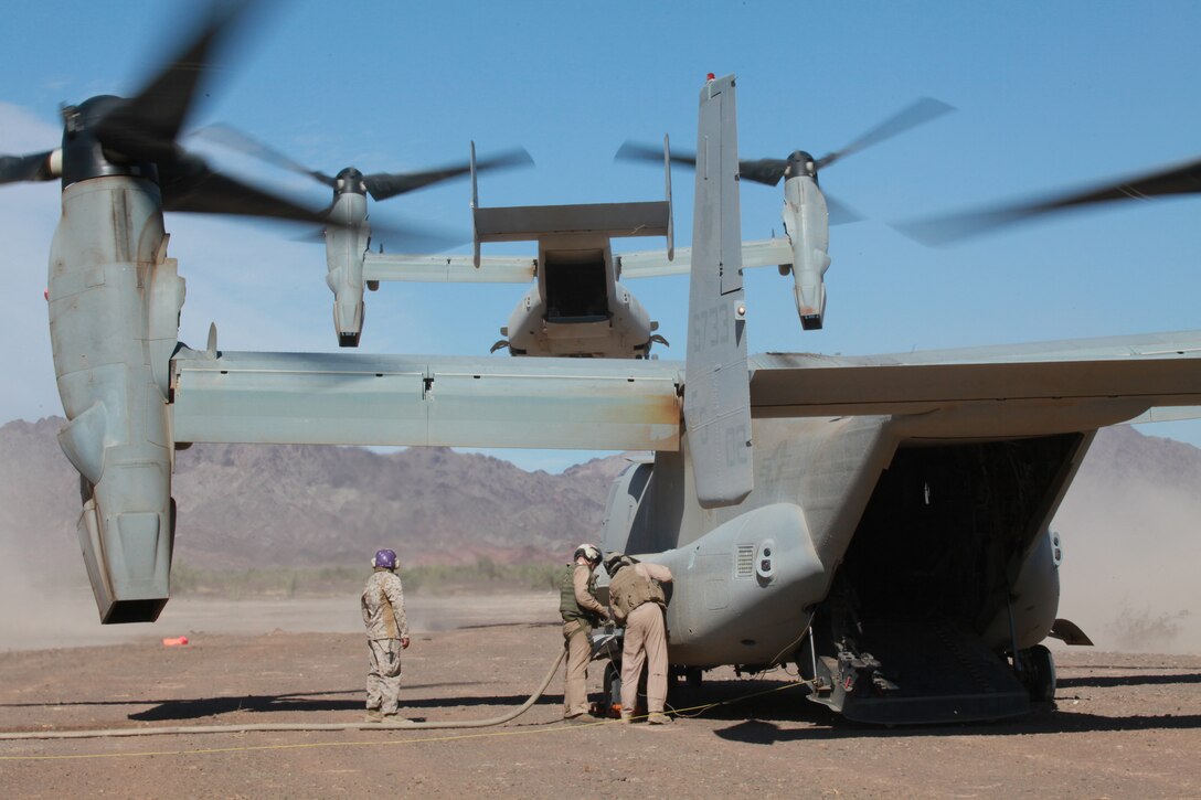 Members of Marine Wing Support Squadron 371 fill up an MV-22 Osprey at a refueling point in the in the Chocolate Mountain Aerial Gunnery Range in southeast California on Oct. 7, 2010, during a training mission as part of Weapons and Tactics Instructor course. The course, hosted twice a year at the Marine Corps Air Station in Yuma, Ariz., by Marine Aviation and Weapons Tactics Squadron 1, trains Marine students from across the globe to return to their units as training officers versed in the latest aviation tactics and procedures. MWSS-371, based in Yuma, provides various support to aviation units including building and manning refueling points, constructing expeditionary airfields and forecasting weather conditions.