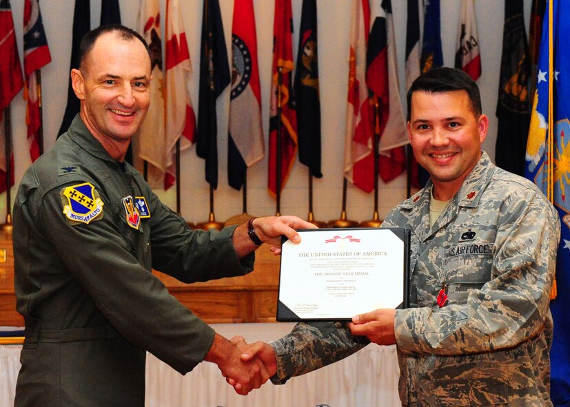 DYESS AIR FORCE BASE, Texas – Maj. Darren Brumfield, 7th Component Maintenance Squadron commander, is awarded the Bronze Star Medal here Sept. 28 by 7th Bomb Wing commander Col. David Beén. While serving as a squadron commander in Afghanistan, Major Brumfield was responsible for standing up the first Afghan Air Wing in Kandahar. He also oversaw the safe transport of 215,600 pounds of cargo and over 1,800 Afghan soldiers, airmen, patients, casualties and captured insurgents. (U.S. Air Force Photo by/ Airman 1st Class Chelsea Cummings)
