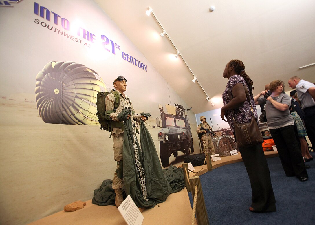 Jackie Chavis looks at the new Air Force Security Forces Museum exhibit honoring the eight security forces Airmen killed in conflict since 2005. Mrs. Chavis's son, Airman 1st Class LeeBernard Chavis, is among the Airmen honored by the exhibit, "Into the 21st Century." Airman Chavis was killed Oct. 14, 2006, while on duty in Baghdad. (U.S. Air Force photo/Robbin Cresswell)