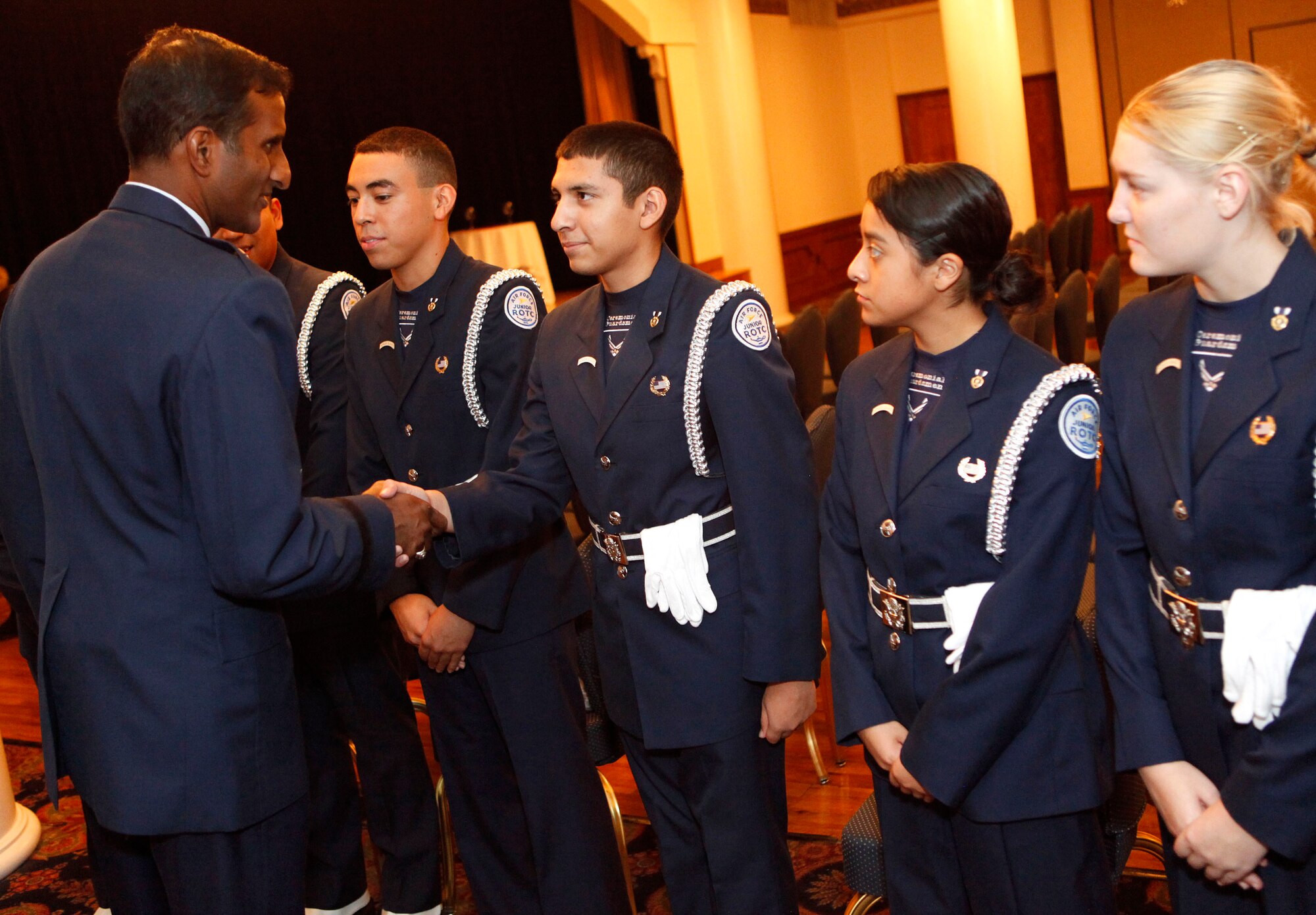 AFRS Commander Brig. Gen. Balan R. Ayyar thanks members of the Air Force Junior ROTC Honor Guard from San Marcos High School, San Marcos, Texas, after his assumption of command ceremony Sept. 7, 2010, at Randolph Air Force Base, Texas. (U.S. Air Force photo/Tech. Sgt. Jeffrey Wolfe)