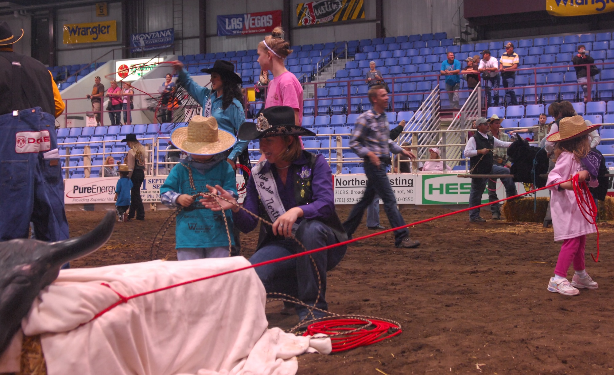 MINOT, N.D. -- Dakota, 4 and Jacob, 3, participate in the steer roping event as part of the Wild West Rodeo for special needs children at the 2010 Y’s Men’s Rodeo here Oct. 7. The 56th annual Y’s Men’s Rodeo is being held at the North Dakota State Fairgrounds through Sunday, Oct. 10 with all proceeds from the rodeo benefiting the YMCA’s Triangle Y camp located near Garrison, N.D. Military appreciation day is Sunday, Oct. 10. All military members, family members and retirees receive half off of the ticket price with a military ID. Tickets may be purchased at the Dakota Square Mall ticket booth or at the North Dakota State Fair Center ticket booth. (U.S. Air Force photo by Laurie Arellano)