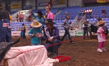 MINOT, N.D. -- Dakota, 4 and Jacob, 3, participate in the steer roping event as part of the Wild West Rodeo for special needs children at the 2010 Y’s Men’s Rodeo here Oct. 7. The 56th annual Y’s Men’s Rodeo is being held at the North Dakota State Fairgrounds through Sunday, Oct. 10 with all proceeds from the rodeo benefiting the YMCA’s Triangle Y camp located near Garrison, N.D. Military appreciation day is Sunday, Oct. 10. All military members, family members and retirees receive half off of the ticket price with a military ID. Tickets may be purchased at the Dakota Square Mall ticket booth or at the North Dakota State Fair Center ticket booth. (U.S. Air Force photo by Laurie Arellano)