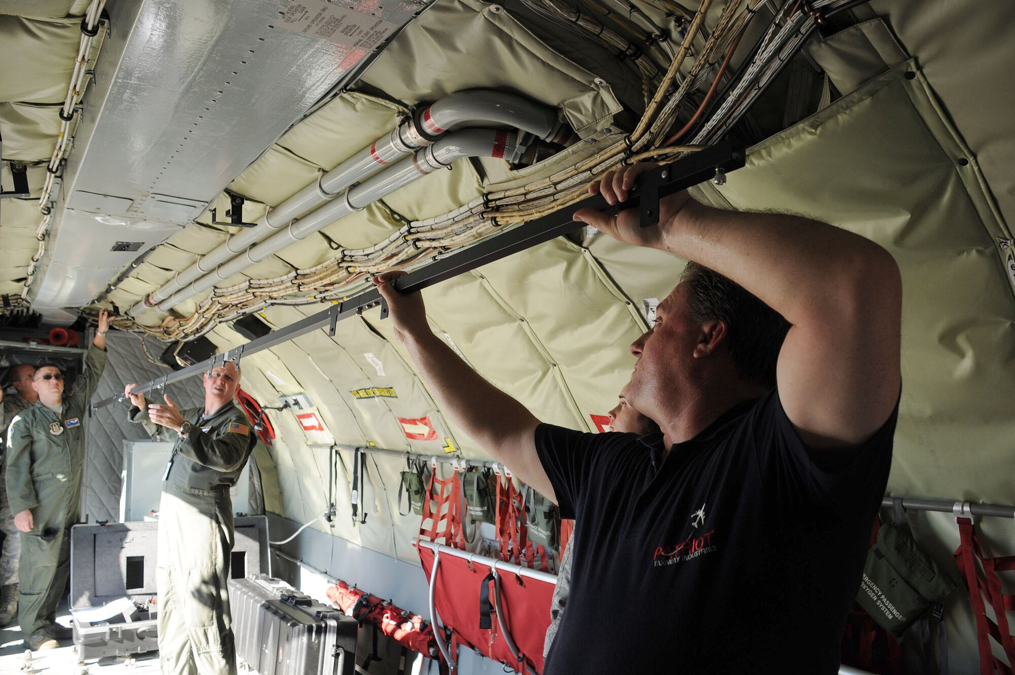 MacDill Air Force Base, Fla. --  Kevin McDermott, pictured at right, developed a lighting system that will mean the difference between night and day for the crew of the KC-135.  This new lighting system will replace an outdated lighting system that had not seen upgrades since the 1950s. (Official United States Air Force photo by Staff Sgt. Shawn C. Rhodes)