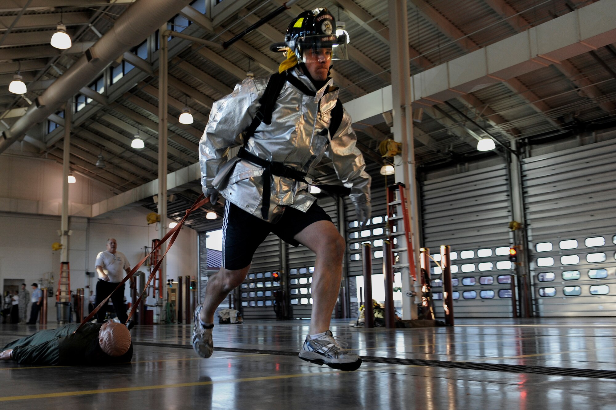 ELLSWORTH AFB, S.D. -Airman 1st Class Alex Stojadinovic, Air Force Financial Services Center financial manager, drags a dummy during the 2010 Ellsworth Firefighter Challenge, Oct. 1.  Airmen from ten agencies at Ellsworth formed teams to participate in the challenge. (U.S. Air Force photo/Staff Sgt. Marc I. Lane)