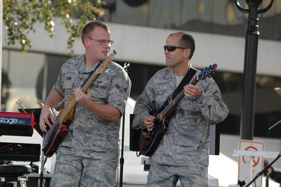 A1C Brian Plank, bass guitarist, and MSgt Jerry Kelley, guitarist and Starlifter's non-commissioned officer in charge, rocked out at a community relations event in Belleville, Illinois