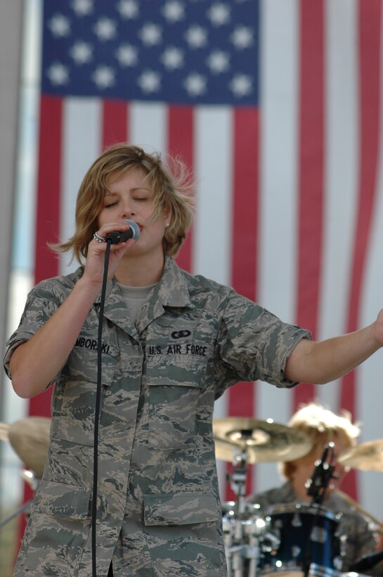 A1C Carmen Emborski displays pure emotion during a patriotic selection at a Belleville, Illinois community relations event