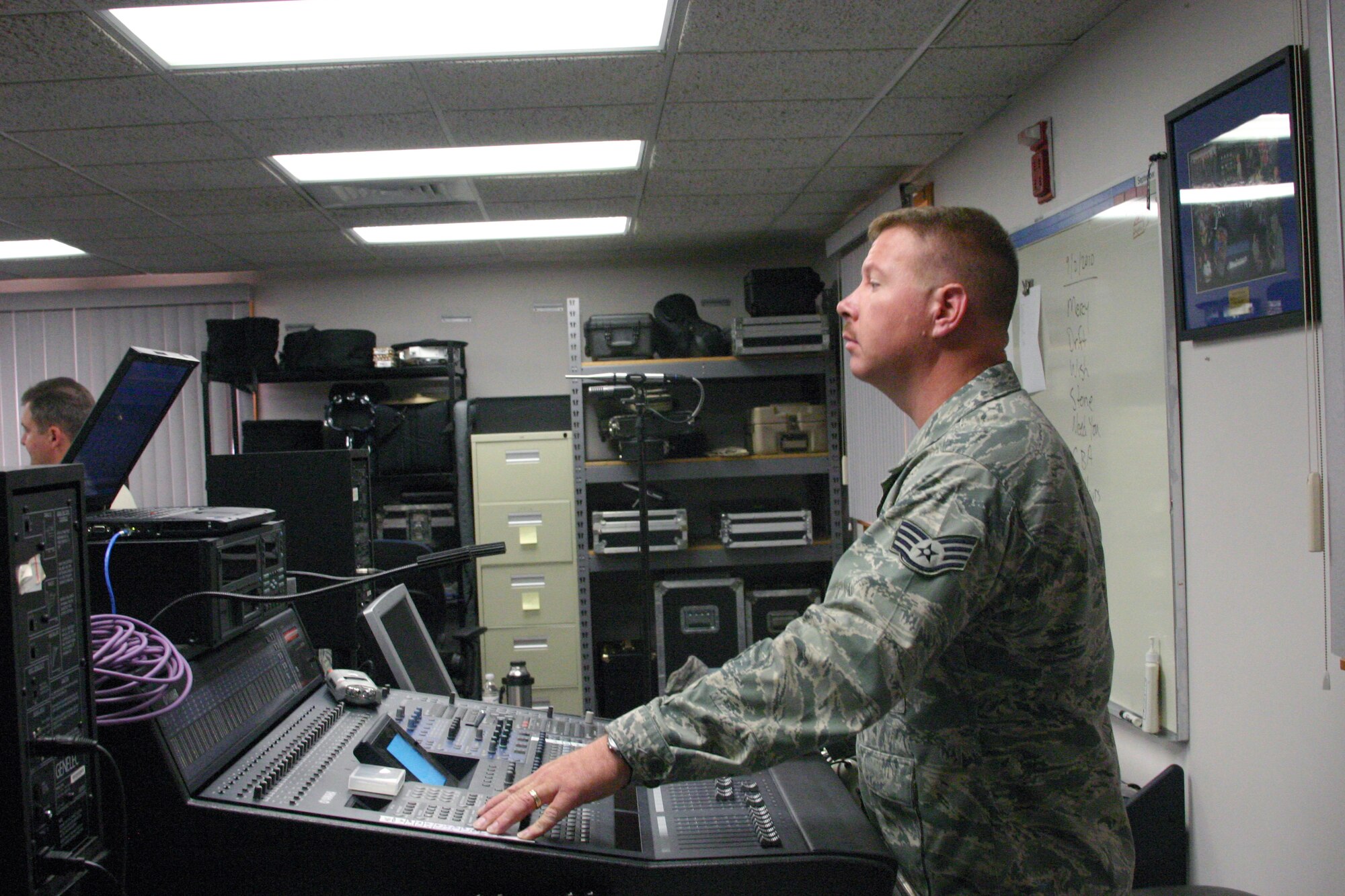 SSgt Ethan Hall, Starlifter’s Audio Engineer, listens intensely during the group’s rehearsal  
