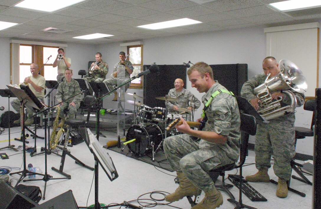 Members of Hot Brass rehearse for upcoming performances