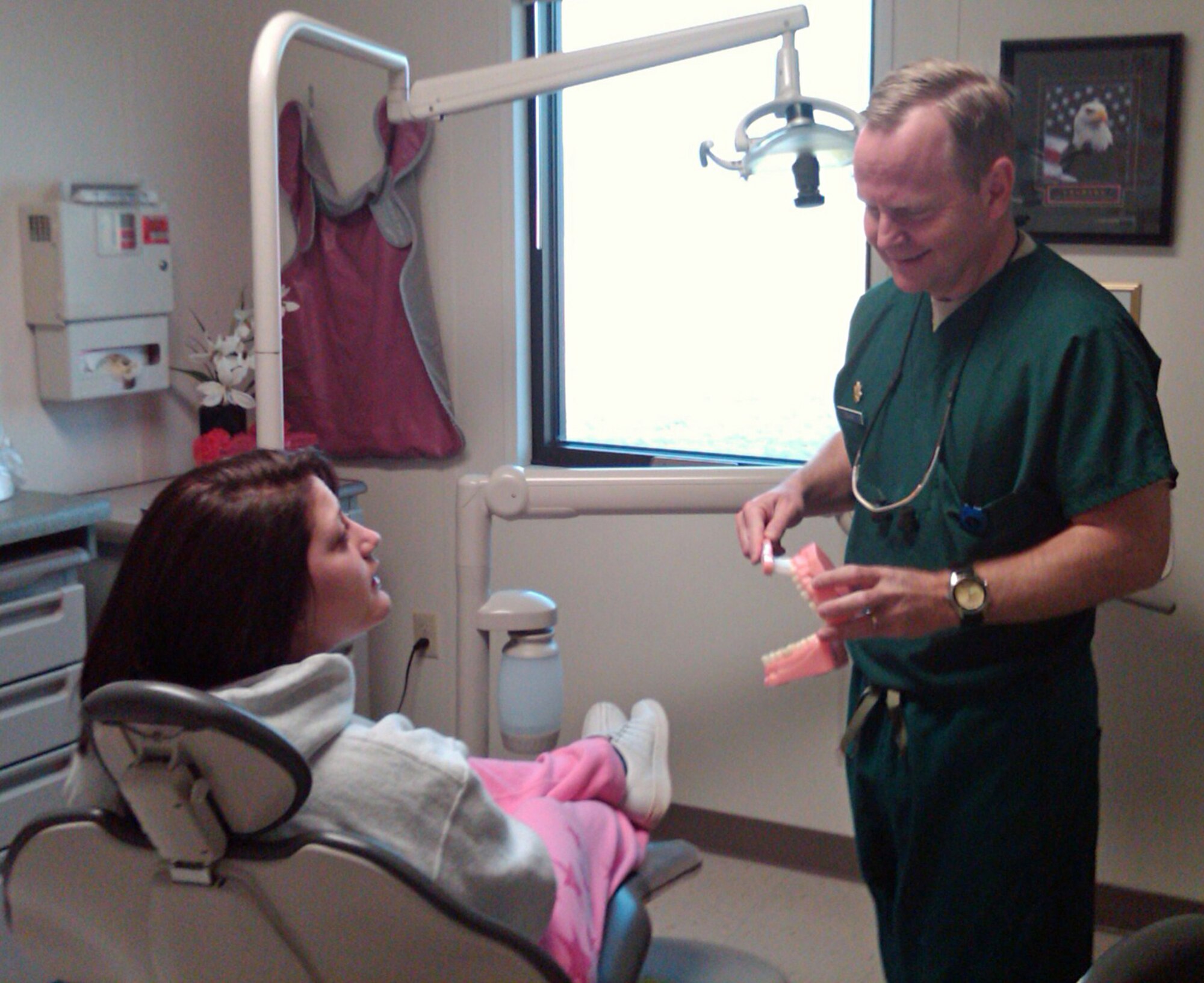 PETERSON AIR FORCE BASE, Colo. – Maj. Kyle Pelkey, 21st Dental Squadron, provides patient education at the Peterson Dental Clinic. October is National Dental Hygiene Month, and focuses on maintaining oral health while leading a busy, active lifestyle. (U.S. Air Force photo)