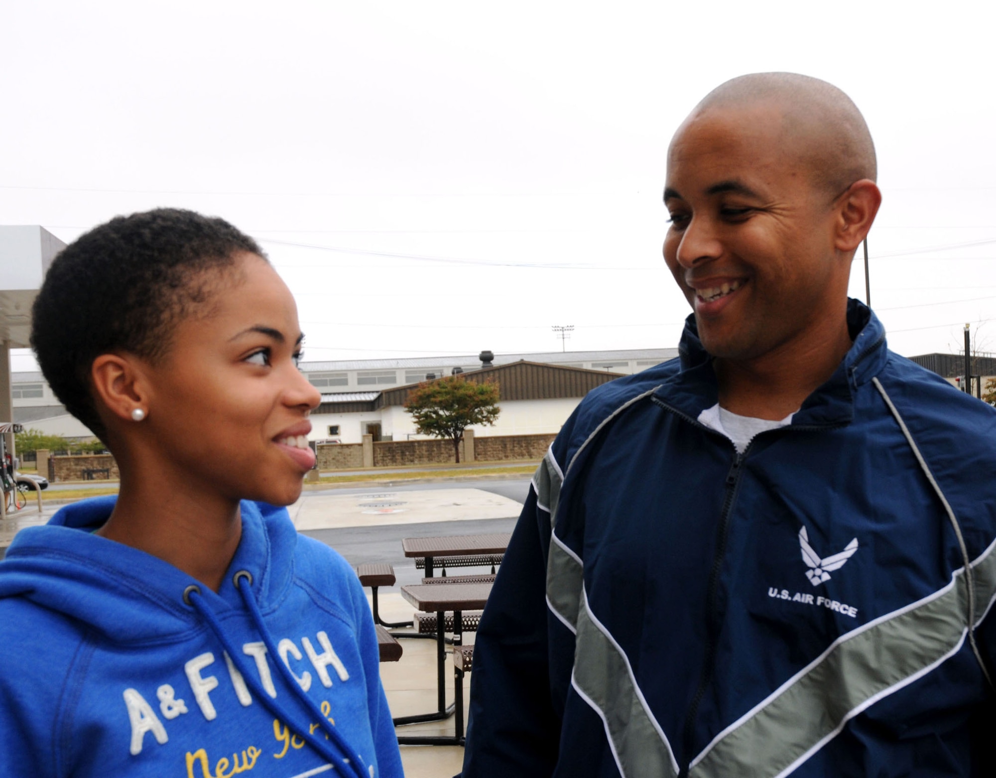 Nadjah Nicole Pennington and her father Tech. Sgt. Wayne Pennington, 512th Airlift Control Flight command post operator, stand outside the shoppette on Dover Air Force Base, Del., Sept. 27, 2010. Nadjah Nicole, a vocalist, enjoyed the success of being an opening act for Grammy Award-winnning singer Macy Gray during a festival in Philaldephia this September. (U.S. Air Force photo by Senior Airman Andria J. Allmond/Released)