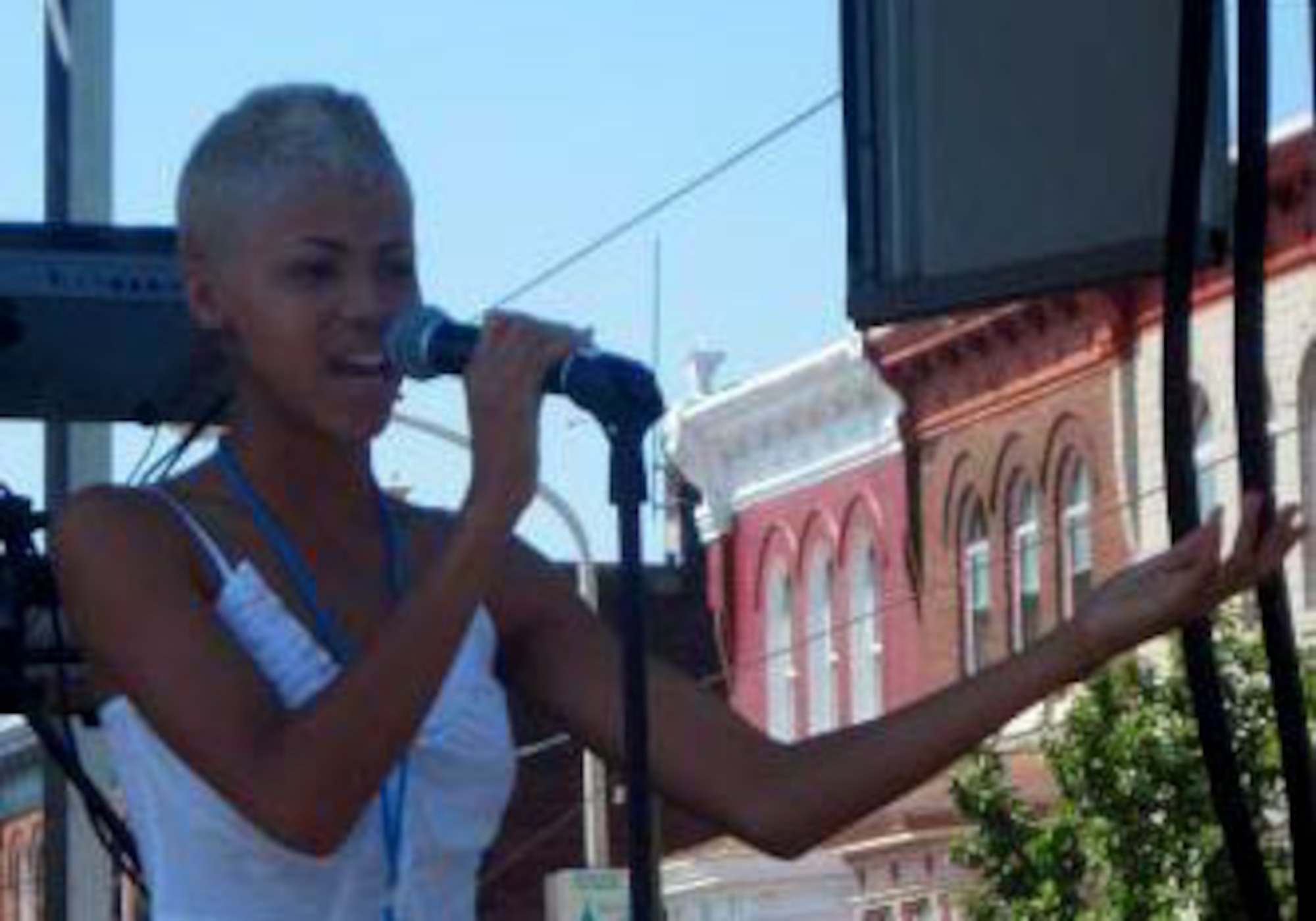 Nadjah Nicole Pennington, daughter of reservist Tech. Sgt. Wayne Pennington, 512th Airlift Control Flight command post operator, performs the National Anthem at the 2009 Neighborhood to Neighborhood Festival held annually in Philadelphia. Nadjah Nicole performed at the event again in September 2010 as an opening act for Grammy Award-winning songstress Macy Gray . (U.S. Air Force photo by Senior Airman Andria J. Allmond/Released) 