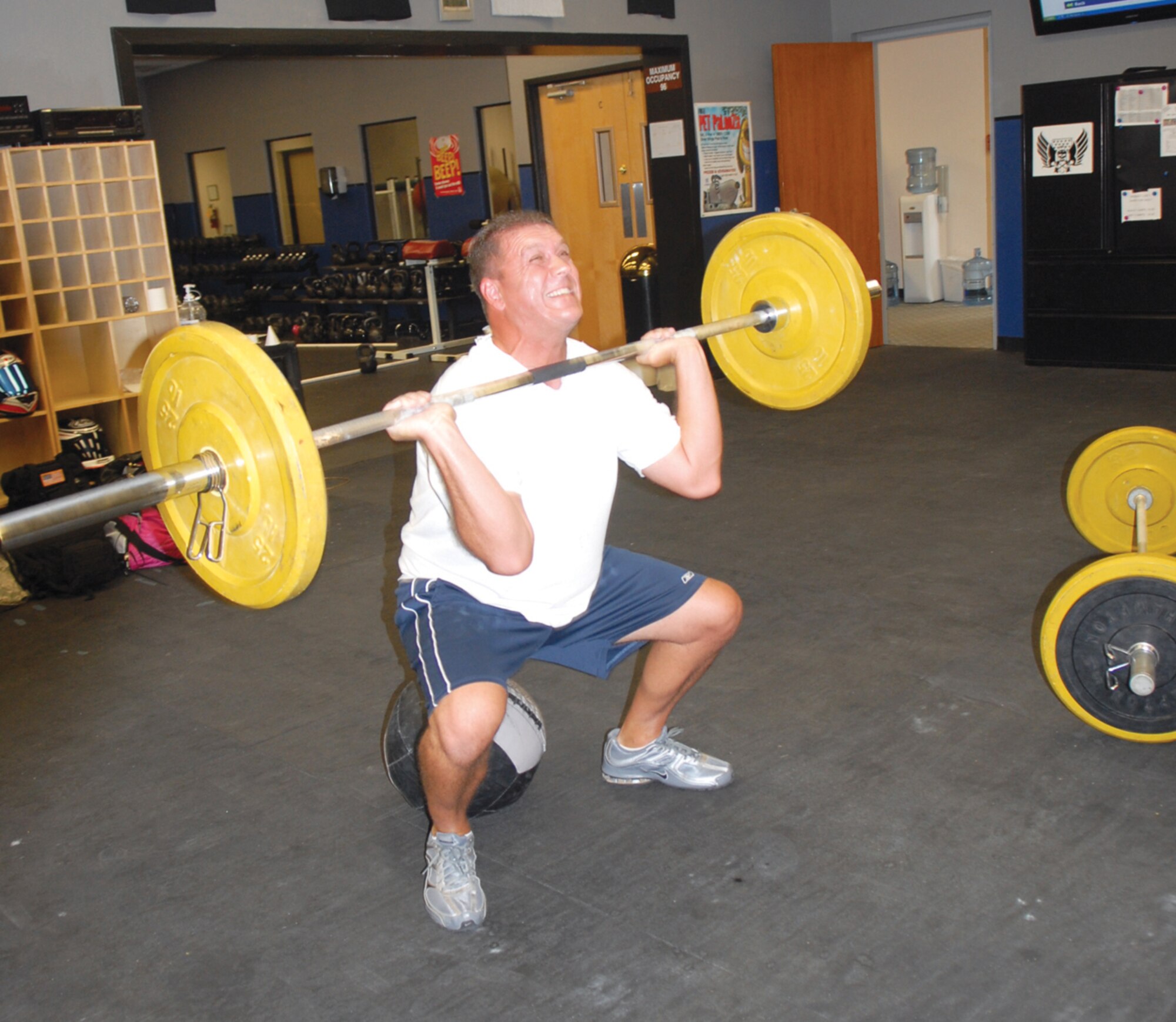Master Sgt. Michael Helm, 62nd Aircraft Maintenance Unit production superintendent, works out on October 6 at CrossFit Luke, Luke Air Force Base, Arizona.  (U.S. Air Force photo/Airman 1st Class Melanie Holochwost)