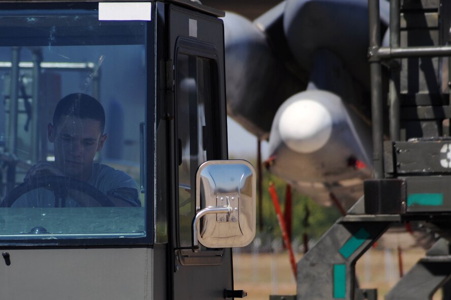 BARKSDALE AIR FORCE BASE, La. -- An Airman from the 2nd Aircraft Maintenance Squadron, weapons load crew pulls a trailer up to a B-52H Stratofortress to prepare for a weapons download during a nuclear operational readiness exercise here Oct. 7. During a NORE Barksdale Airmen undergo scenarios in coordination with the U.S. Strategic Command directives. (U.S. Air Force photo/Senior Airman Brittany Y. Bateman)(RELEASED)