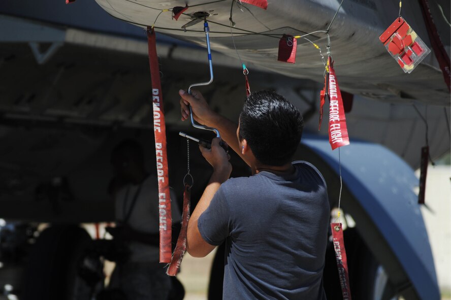 BARKSDALE AIR FORCE BASE, La. -- An Airman from the 2nd Aircraft Maintenance Squadron, weapons load crew, perform safe maintenance checks during a nuclear operational readiness exercise here, Oct. 7. During a NORE Barksdale Airmen undergo scenarios in coordination with the U.S. Strategic Command directives. (U.S. Air Force photo/Senior Airman Brittany Y. Bateman)(RELEASED)