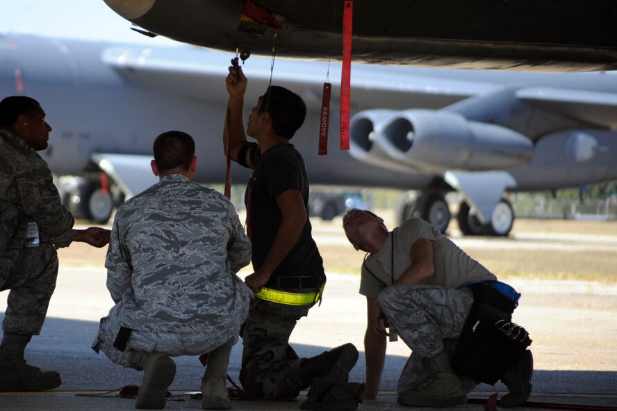 BARKSDALE AIR FORCE BASE, La. -- Airmen from the 2nd Aircraft Maintenance Squadron, weapons load crew, perform safe maintenance checks during a nuclear operational readiness exercise here Oct. 7. During a NORE Barksdale Airmen undergo scenarios in coordination with the U.S. Strategic Command directives. (U.S. Air Force photo/Senior Airman Brittany Y. Bateman)(RELEASED)