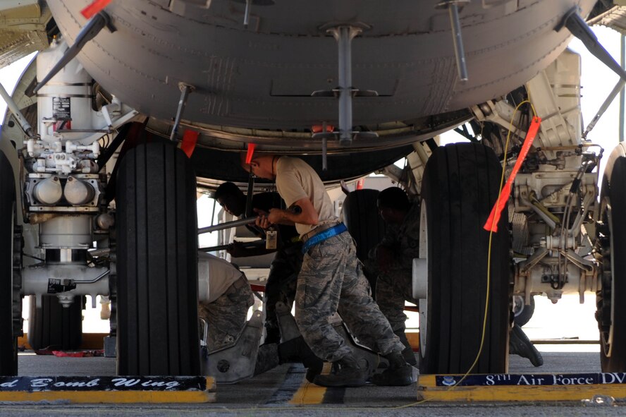 BARKSDALE AIR FORCE BASE, La. -- Airmen from the 2nd Aircraft Maintenance Squadron, weapons load crew, open the bomb bay doors to a B-52H Stratofortress before a weapons download during a nuclear operational readiness exercise Oct. 7. During a NORE Barksdale Airmen undergo scenarios in coordination with the U.S. Strategic Command directives. (U.S. Air Force photo/Senior Airman Brittany Y. Bateman)(RELEASED)