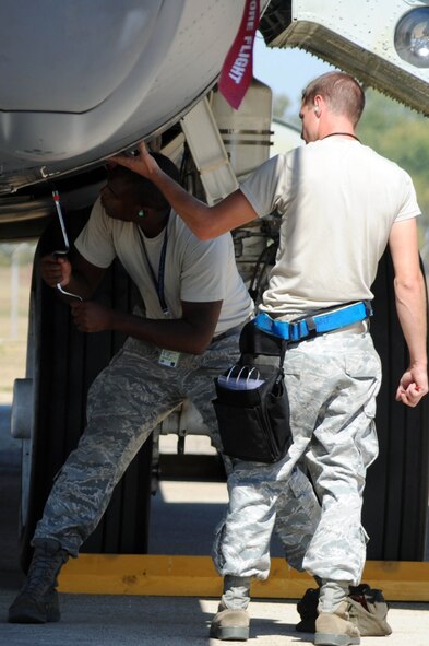 BARKSDALE AIR FORCE BASE, La. -- Airmen from the 2nd Aircraft Maintenance Squadron, weapons load crew, perform safe maintenance checks during a nuclear operational readiness exercise here, Oct. 7. During a NORE Barksdale Airmen undergo scenarios in coordination with the U.S. Strategic Command directives. (U.S. Air Force photo/Senior Airman Brittany Y. Bateman)(RELEASED)