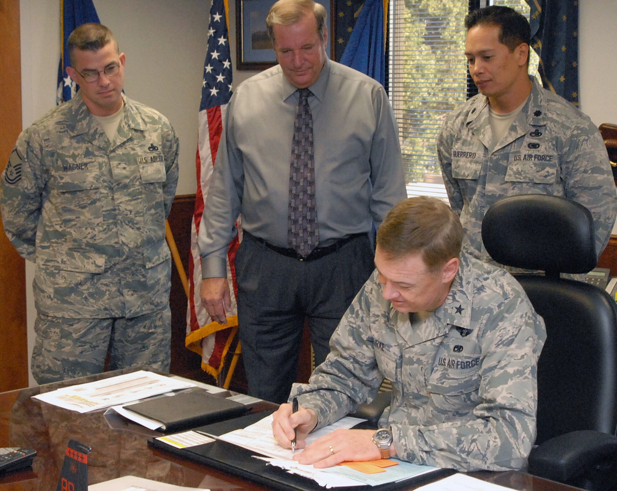 Brig. Gen. Darryl Burke, 82nd Training Wing Commander, Sheppard Air Force Base, Texas, fills out his absentee voting ballot during an office call with wing voting representatives from the 82 Training Group. Pictured are Master Sgt. James Wagner, Mr. Clifton Scribner and Lt. Col. Mark Guerrero, 82 Training Group deputy commander.  For more information about registration and voting or to fill out your registration form or ballot on line, visit www.FVAP.gov or www.canivote.org.  (U.S. Air Force/Lou Anne Sledge)