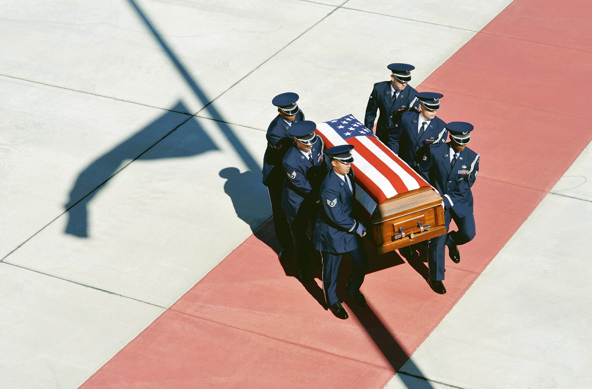 Robins Honor Guard members carry the casket of Senior Airman Michael Buras to an awaiting hearse Oct. 2, 2010 on the Robins flightline Saturday. (U. S. Air Force photo/Gary Cutrell)