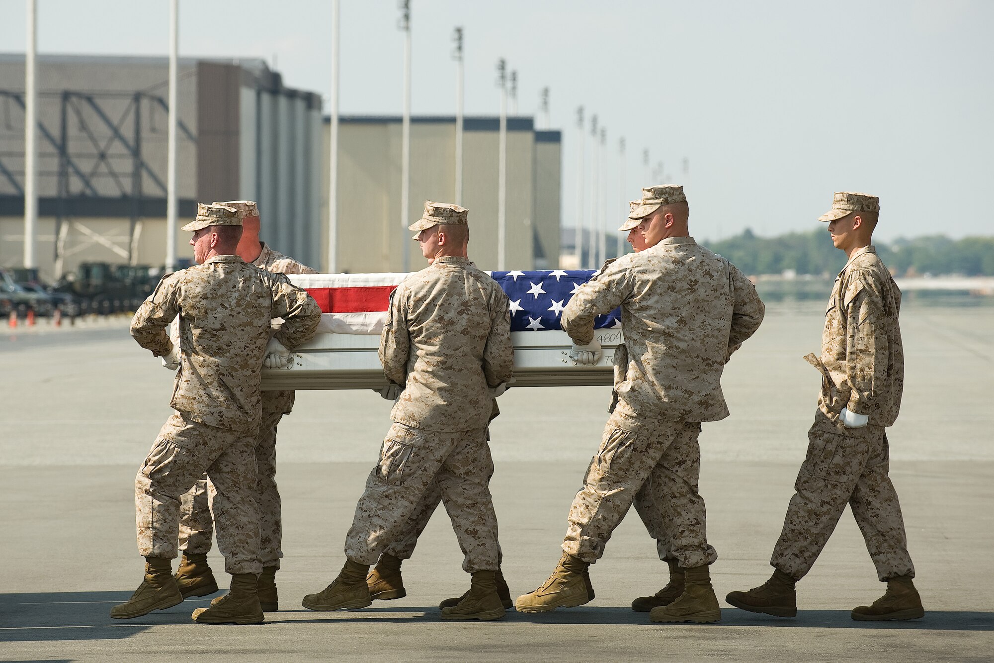 A U.S. Marine Corps carry team transfers the remains of Marine Lance Cpl. Anthony J. Rosa of Swanton, Vt., at Dover Air Force Base, Del., Sept. 25, 2010.  Rosa was assigned to 2nd Battalion, 6th Marine Regiment, 2nd Marine Division, II Marine Expeditionary Force, Camp Lejeune, N.C. (U.S. Air Force photo/Jason Minto)