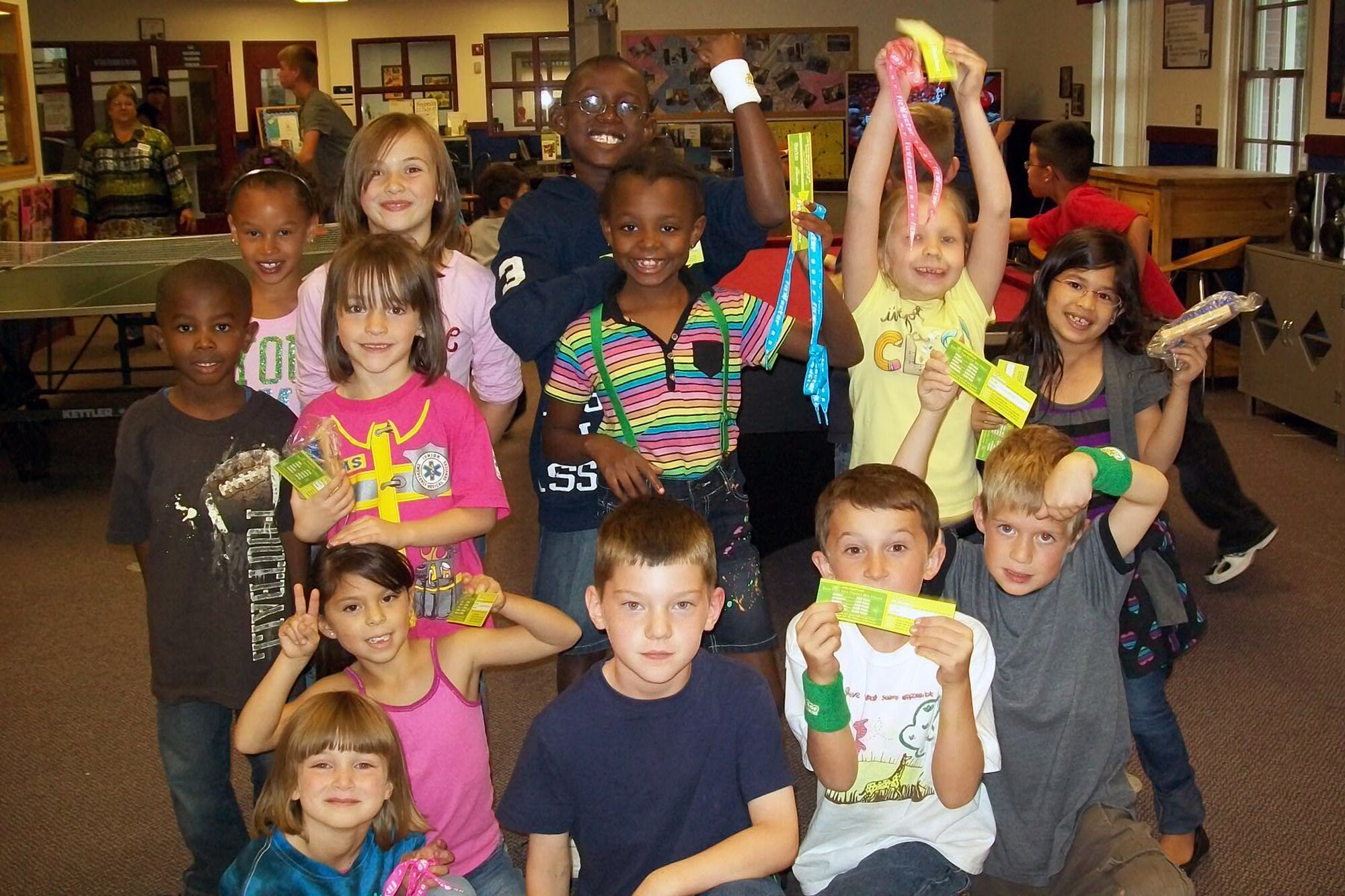 Children at the Warren Youth Center show off their FitFactor enrollment cards and incentive prizes. The Youth Center hosts "FitFactor Friday" activities weekly for the children enrolled in the school age program. Currently there are 120 people from F. E. Warren enrolled in the program. FitFactor is a Web based incentive program to encourage Air Force youth and families to “Get Up, Get Out, Get Fit” by having fun, being active, eating right, and pursuing fitness goals. Those enrolled earn points for prizes. Visit the Youth Center to get enrolled and join in the FitFactor fun. Parents and youth programs staff can register and log points with their children. 
Visit http://www.afgetfit.com. For more details call the Youth Center at 773-2564.
(Courtesy photo)