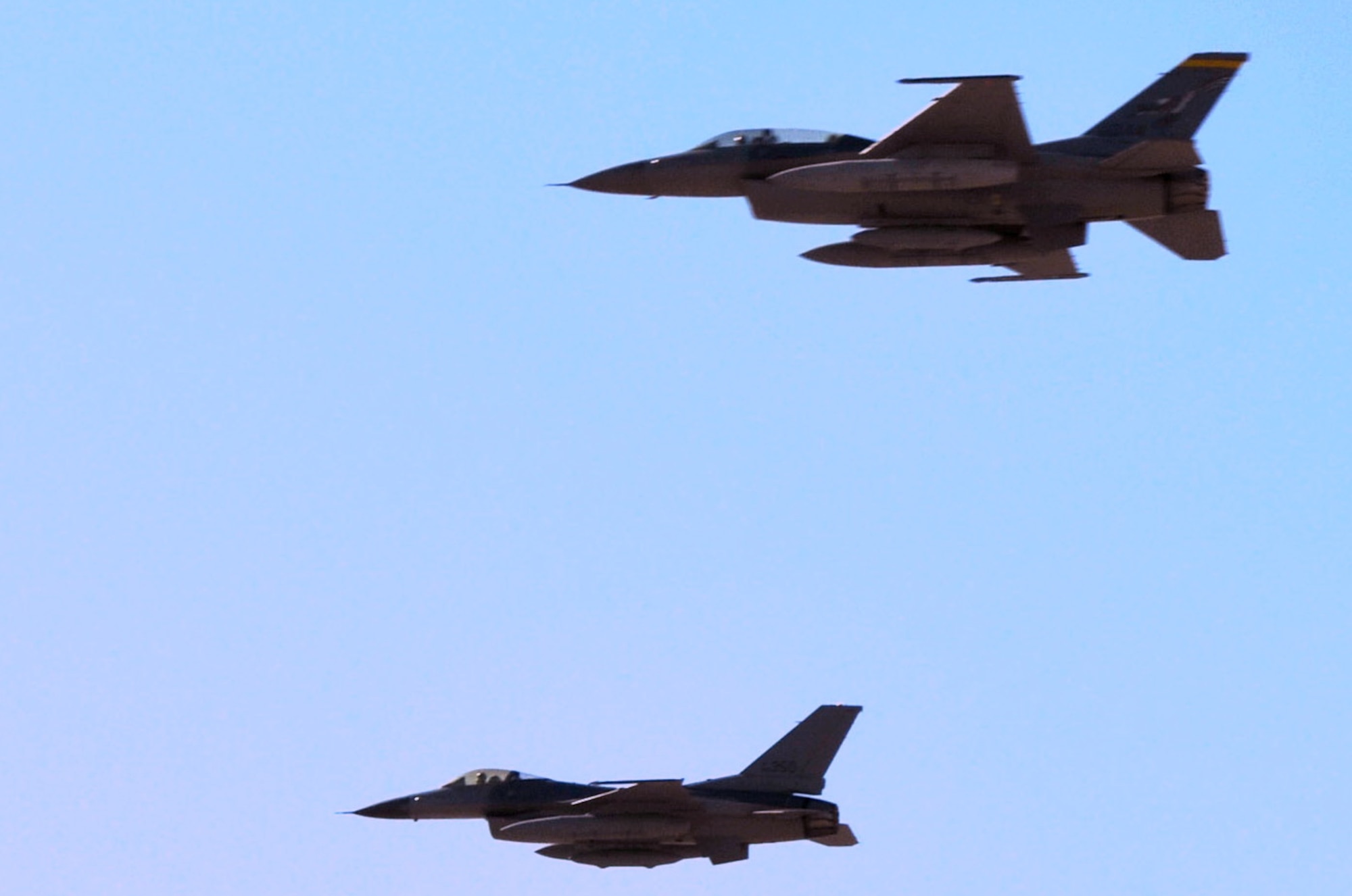 Col. Frederik Hartwig(acft 350) and Lt. Col. Christopher Thomson (acft 044), both F-16 pilots with the New Mexico Air National Guards 150th Fighter Wing, fly over a crowd of onlookers for the last time Sunday, Sept. 26, 2010 on Kirtland Air Force Base. The pilots took the last two F-16s to the District of Columbia Air National Guard. (U.S. Air Force photo by Master Sgt. Paula Aragon) 