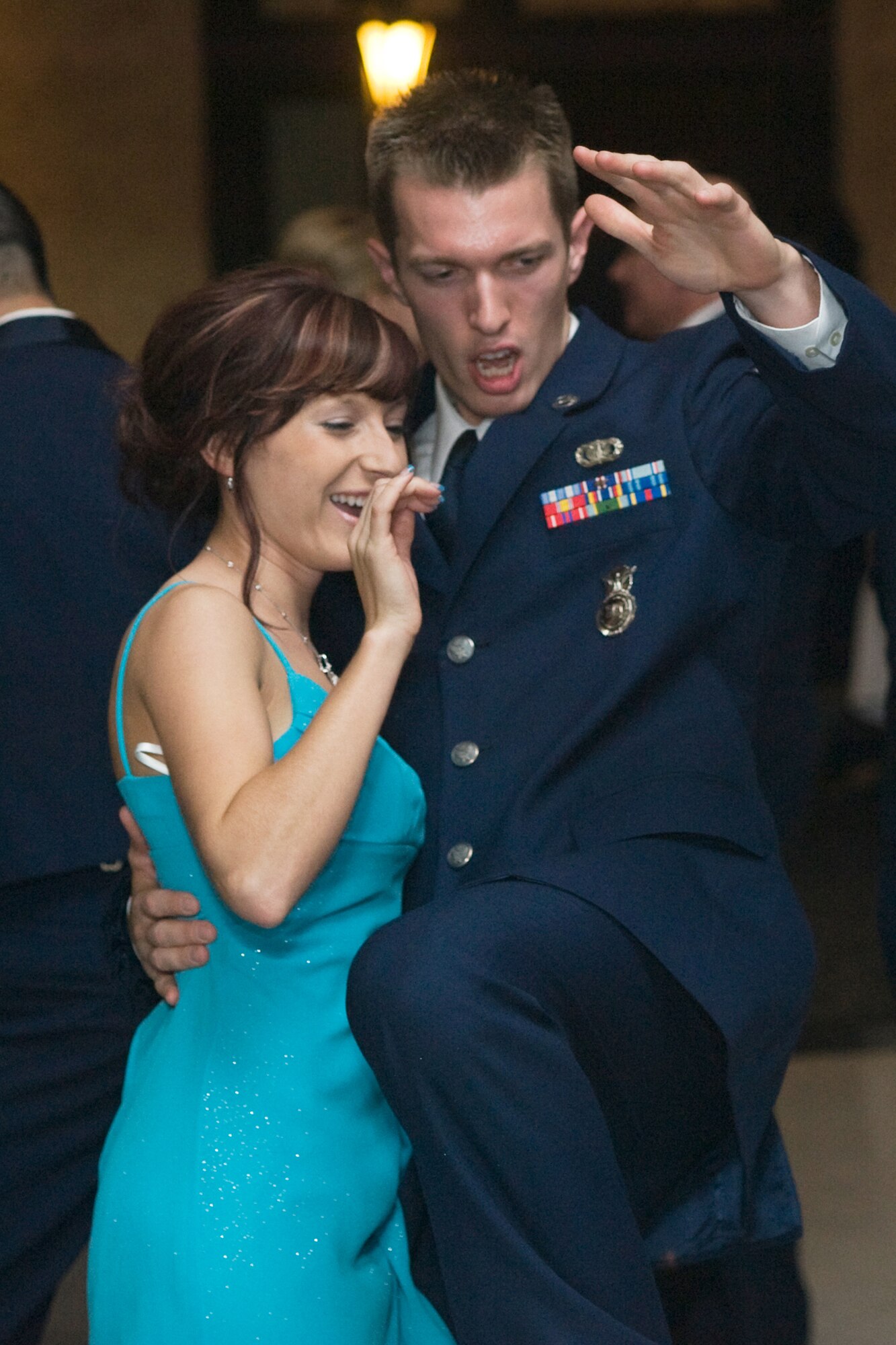 A security forces Airman and his date get some dancing in during the Wing One Air Force Anniversary Ball OCt. 2 (U.S. Air Force photo/Beau Wade)