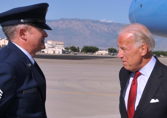 Chief Master Sgt. Vernon Thompson, 377th Air Base Wing command chief, speaks with Vice President Biden.  U.S. Air Force Photo by Todd Berenger.