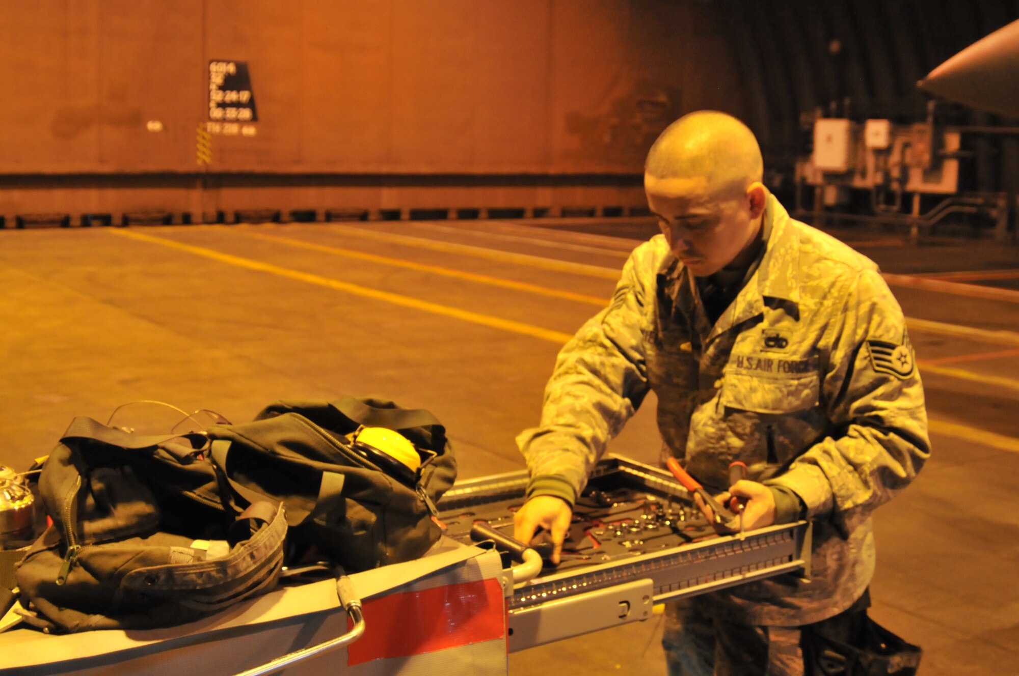 ROYAL AIR FORCE LAKENHEATH, England – Staff Sgt. Jorge Viera, 48th Maintenance Group weapons load crew ‘two’ man, puts away tools during a set piece demonstration Oct. 7. All tools must be accounted for before an aircraft can be cleared for flight to ensure none were left on the aircraft to potentially cause damage. (U.S. Air Force photo/Senior Airman David Dobrydney)