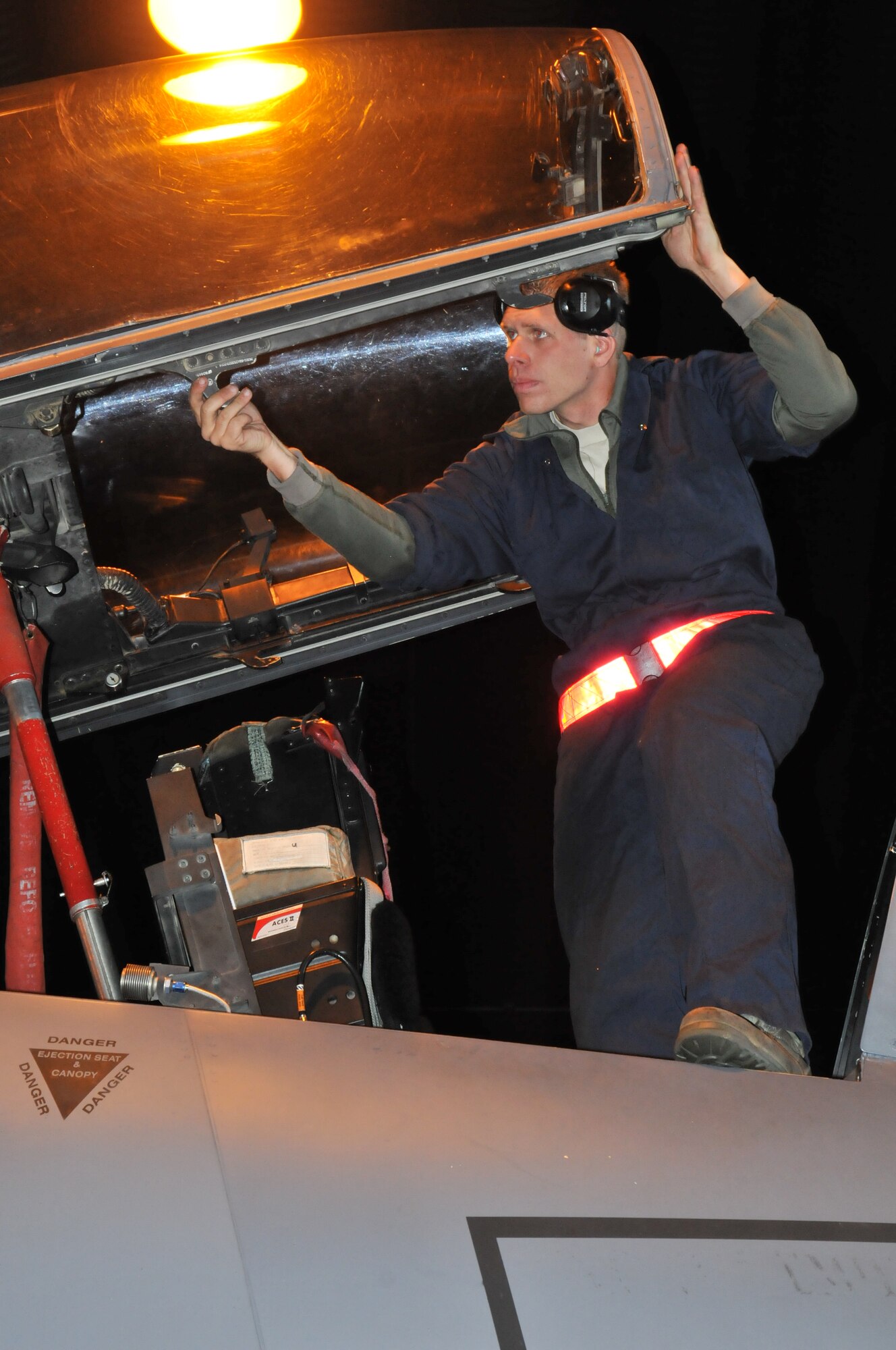 ROYAL AIR FORCE LAKENHEATH, England – Staff Sgt. Jason Siler, 494th Aircraft Maintenance Unit crew chief, checks the canopy of an F-15E Strike Eagle during a set piece demonstration here Oct. 7. Sergeant Siler and four other team members were tasked with checking, refueling and rearming an aircraft within three hours. (U.S. Air Force photo/Senior Airman David Dobrydney)