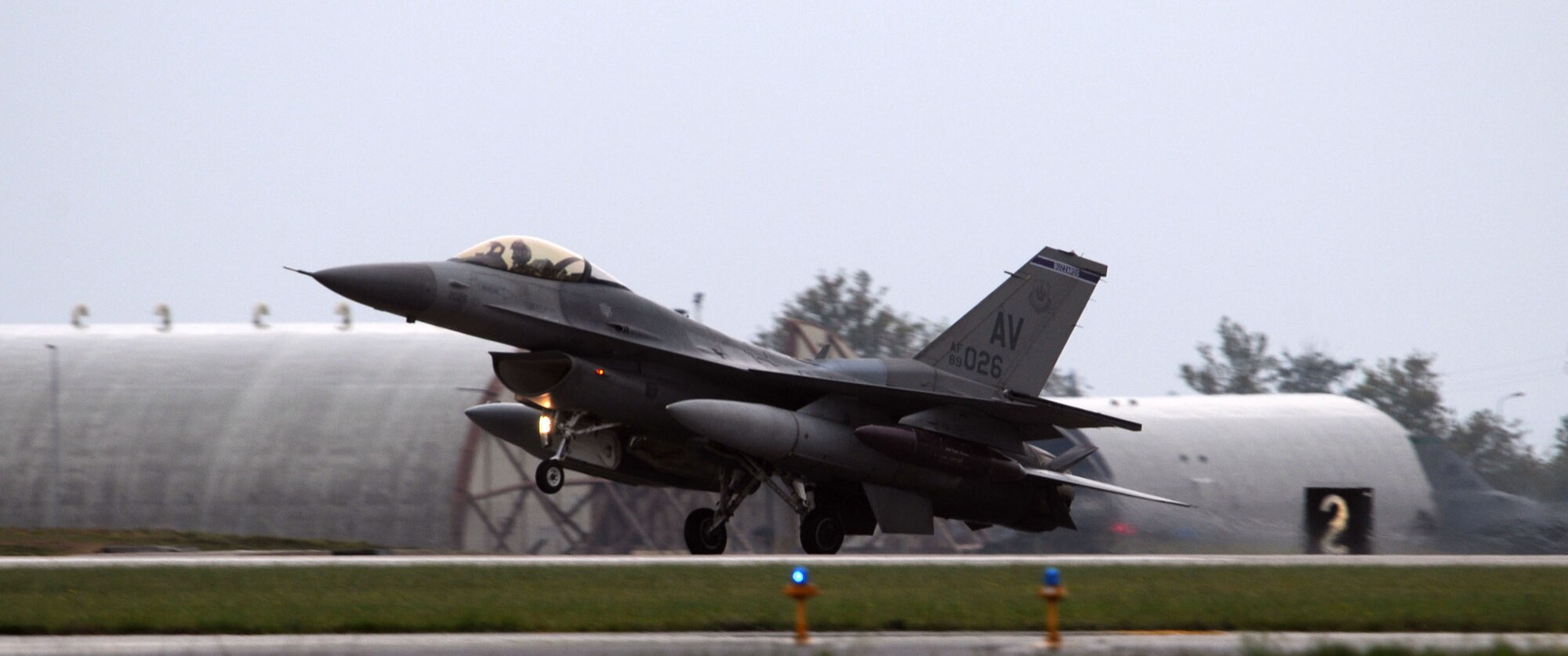 A 510th Fighter Squadron F-16 Fighting Falcon lands at Aviano Air Base runway Oct. 4. Team Aviano welcomed back approximately 300 Airmen Oct. 4 and 6 from a four-and-a-half-month deployment in support of Operation Enduring Freedom. (U.S. Air Force photo/Staff Sgt. Julius Delos Reyes)