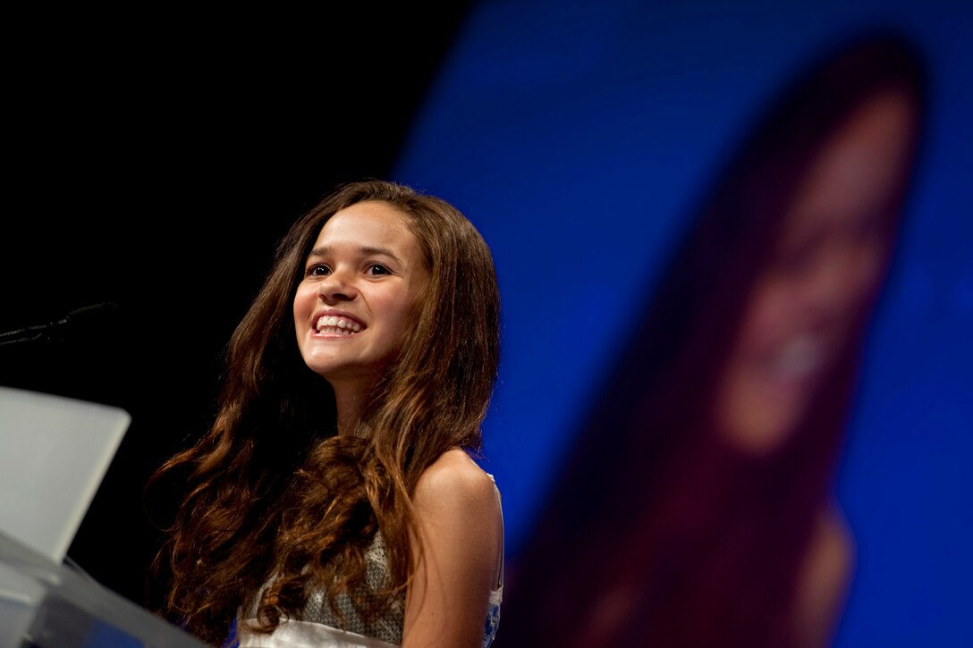 Actress Madison Pettis introduces the United Through Reading Program at the USO Gala in Washington, D.C., Oct. 7, 2010. The program allows servicemembers overseas to read to their children while being recorded on DVD. Copies of the book, DVD and instructions are then shipped to the servicemembers' children.