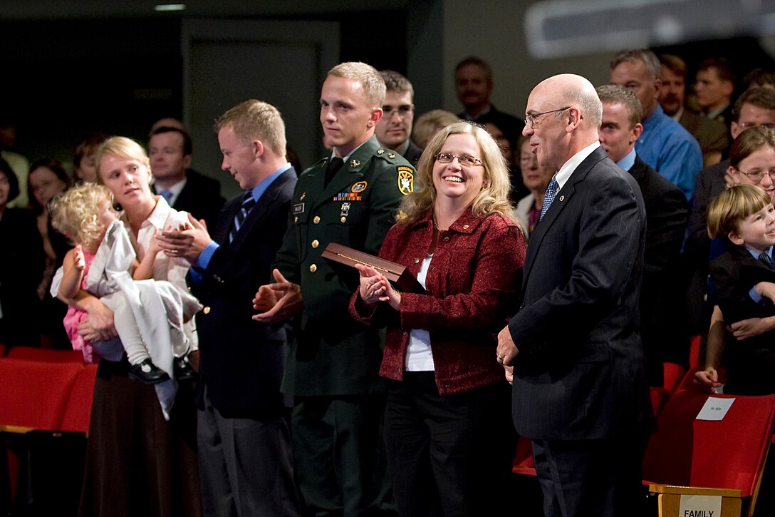 Maureen and Phil Miller, parents of Medal of Honor recipient U.S. Army Staff Sgt. Robert J. Miller, attend a ceremony for their son at the Pentagon, Oct. 7, 2010.