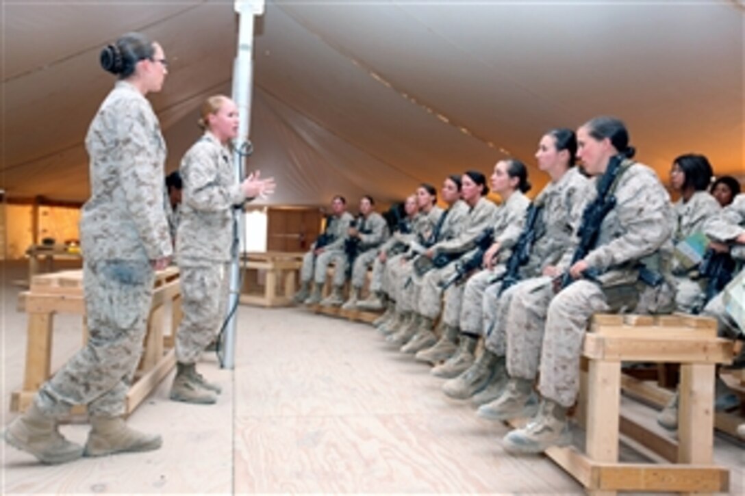 U.S. Marines with female engagement team 10-2 are welcomed and briefed by leaders at Camp Leatherneck, Afghanistan, on Sept. 25, 2010.  