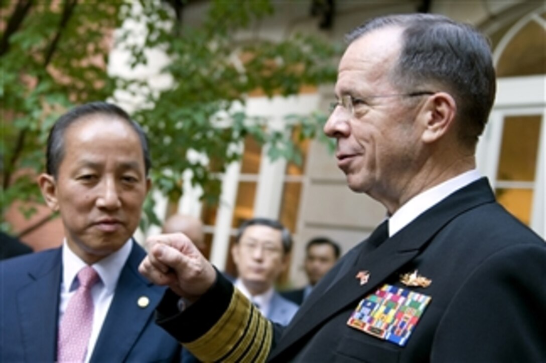 Chairman of the Joint Chiefs of Staff Adm. Mike Mullen speaks with South Korean Defense Minister Kim Tae-Young and other defense officials during a reception hosted by Secretary of Defense Robert M. Gates held in conjunction with the 42nd annual R.O.K.-U.S. Security Consultative Meeting at the Blair House in Washington, D.C., on Oct. 7, 2010.  