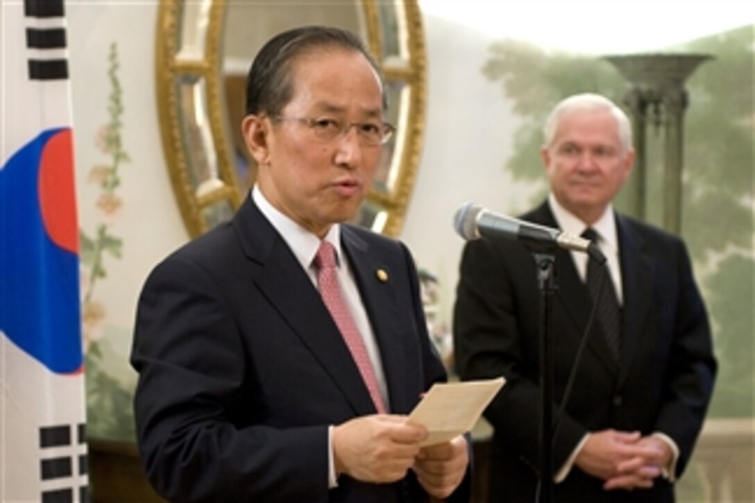 South Korean Defense Minister Kim Tae-Young (left) speaks to the audience and Secretary of Defense Robert M. Gates during a reception held in conjunction with the 42nd annual R.O.K.-U.S. Security Consultative Meeting at the Blair House in Washington, D.C., on Oct. 7, 2010.  