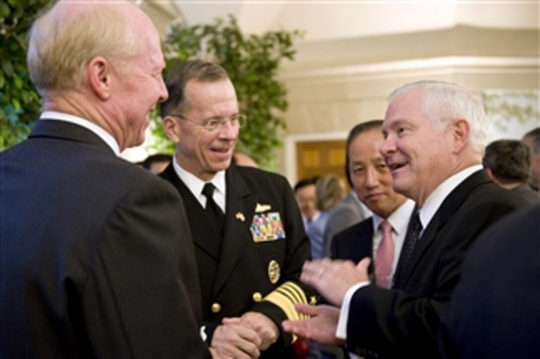 Secretary of Defense Robert M. Gates speaks with Commander of U.S. Pacific Command Adm. Robert F. Willard (left), Chairman of the Joint Chiefs of Staff Adm. Mike Mullen (2nd from left) and South Korean Defense Minister Kim Tae-Young during a reception held in conjunction with the 42nd annual R.O.K.-U.S. Security Consultative Meeting at the Blair House in Washington, D.C., on Oct. 7, 2010.  