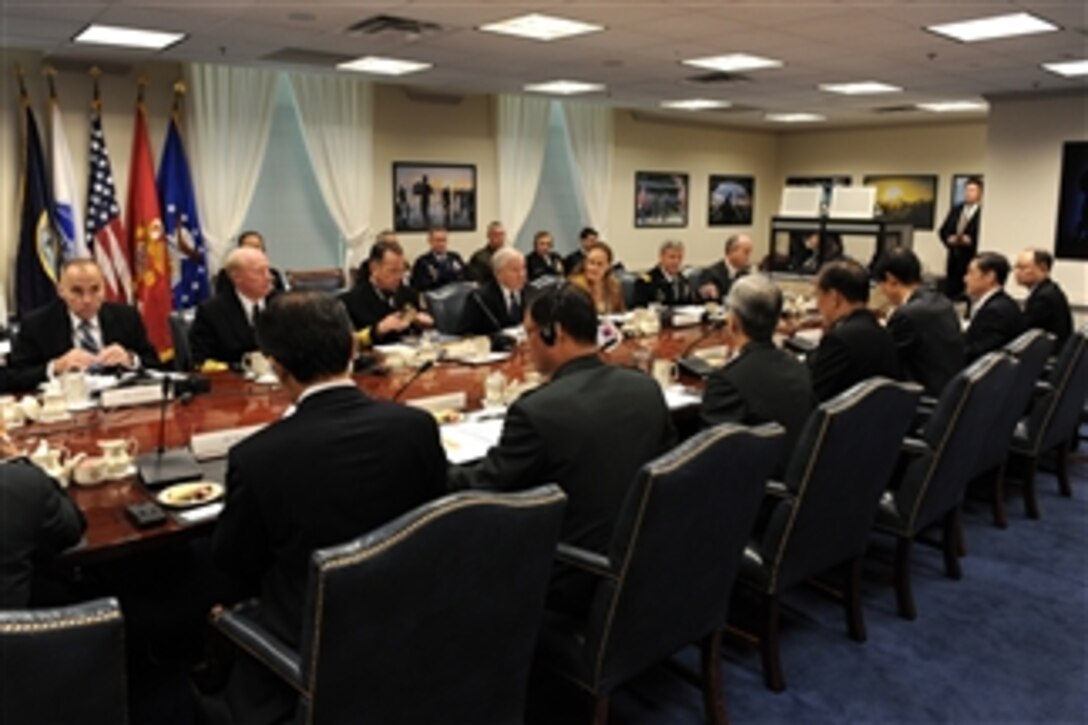 The plenary session of the 42nd annual Republic of Korea - U.S. Security Consultative Meeting gets underway in the Pentagon on Oct. 8, 2010.  Participants include Assistant Secretary of Defense for Asian-Pacific Security Affairs Chip Gregson (left), Commander of U.S. Pacific Command Adm. Robert Willare, Chairman of the Joint Chiefs of Staff Adm. Mike Mullen, Secretary of Defense Robert M. Gates, Under Secretary of Defense for Policy Michele Flournoy, Commander of United Nations Command, Combined Forces Command and U.S. Forces Korea Gen. Walter L. Sharp and Principal Deputy Assistant Secretary of State for East Asian and Pacific Affairs Joe Donovan.  