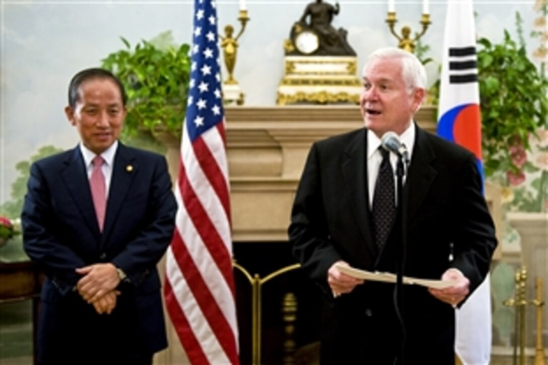U.S. Defense Secretary Robert M. Gates speaks to the audience and South Korean Defense Minister Kim Tae-young, left, during a reception in conjunction with an annual security meeting between the two countries in Washington, D.C., Oct. 7, 2010.