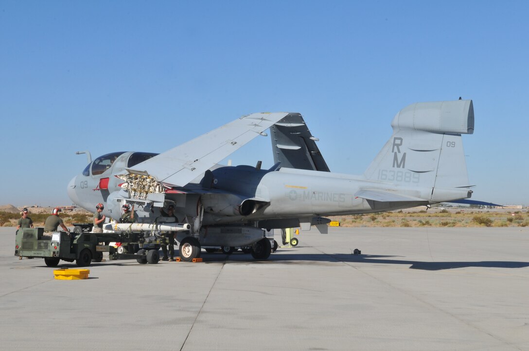 Marine Tactical Electronic Warfare Squadron 4 ordnance Marines mount a high-speed, anti-radiation missile on an EA-6B Prowler jet at the Marine Corps Air Station in Yuma, Ariz., Oct. 8, 2010. The Cherry Point, N.C.,-based squadron fired a total of 14 HARMs at targets in the Pacific Ocean as part of the Weapons and Tactics Instructor course in Yuma. The HARM finds its targets by detecting electromagnetic radiation and is also the only missile the Prowler jets fire.