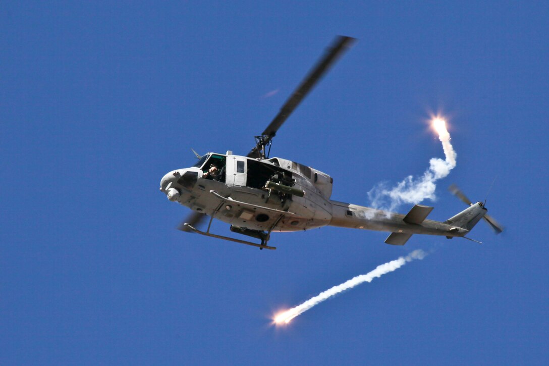 A U.S. Marine UH-1N Huey helicopter fires counter measures over the Imperial Desert in California on Oct. 8, 2010, during a training mission as part of Weapons and Tactics Instructor Course. The course, hosted twice a year in Yuma by Marine Aviation and Weapons Tactics Squadron 1, trains Marine students from across the globe to return to their units as training officers versed in the latest aviation tactics and procedures. The UH-1 Huey is often used for aerial reconnaissance and close air support.